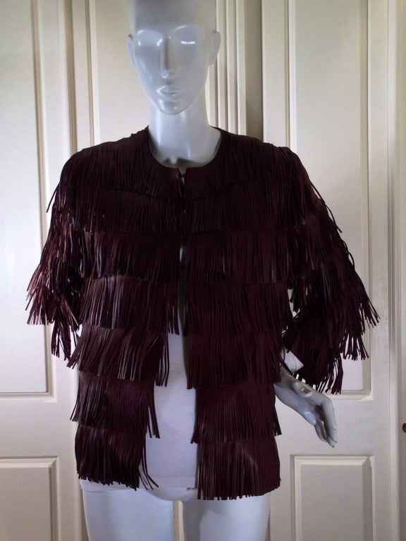 Shake what Prada gave you!  This fabulous leather jacket is not only an amazing fashion statement, but also an incredible piece of workmanship.  Super soft leather is layered by more leather in a fun, fringe style.  Hook and eyes run down the front