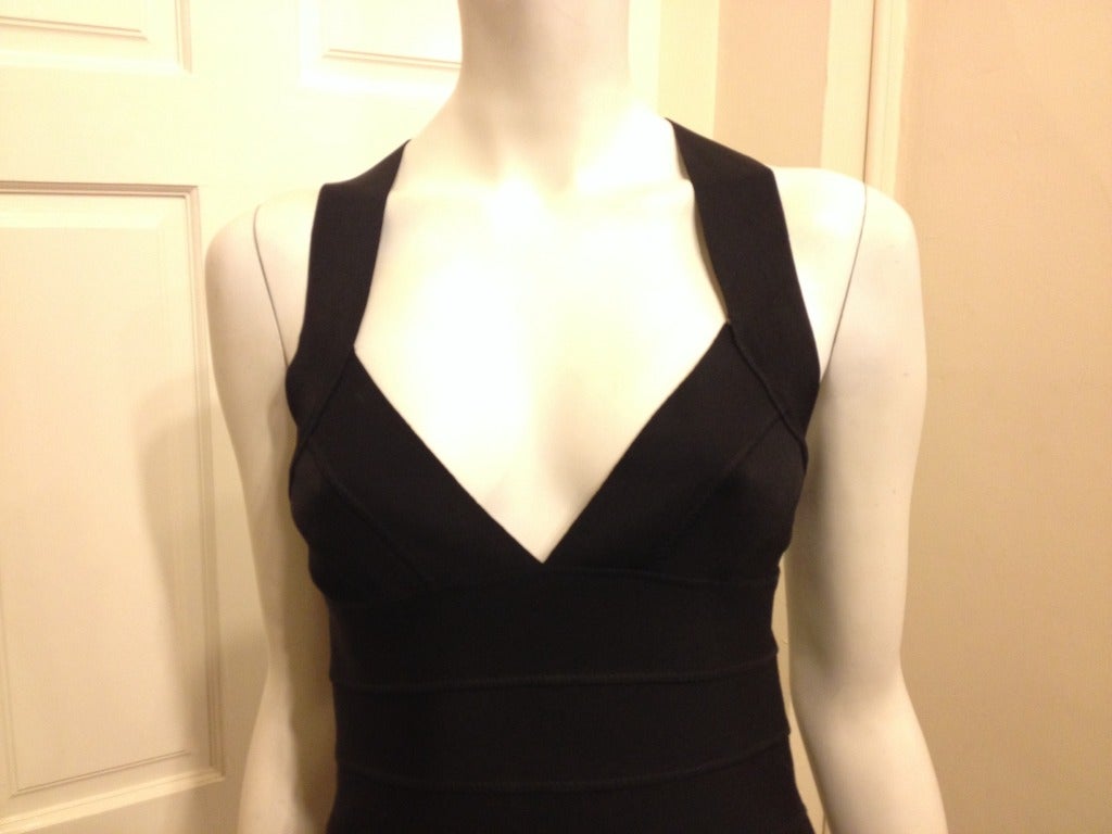 We are always on the lookout for the perfect little black dress, and this one definitely makes the grade.  The thick bandage style top gives you a flattering shape and support.  We love the plunging neckline and criss-cross back details.  The knit