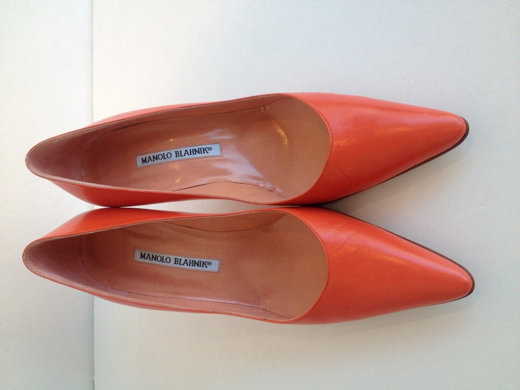 Orange is the new black and with these fabulous orange Manolo Blahnik heels you can add a bit of color to your everyday look. With a 3 inch heel, they are a great shoe to wear during the day. The pointy toe gives you a sharp look as you walk down