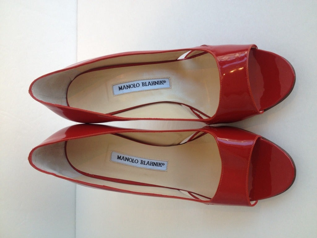 What is more fierce then a women in red patent leather shoes? These Manolo Blahniks have a real attitude about them!  The 3.5 inch thin, square heel and side cut outs will bring edge to any outfit. These will be great for a night out when you want