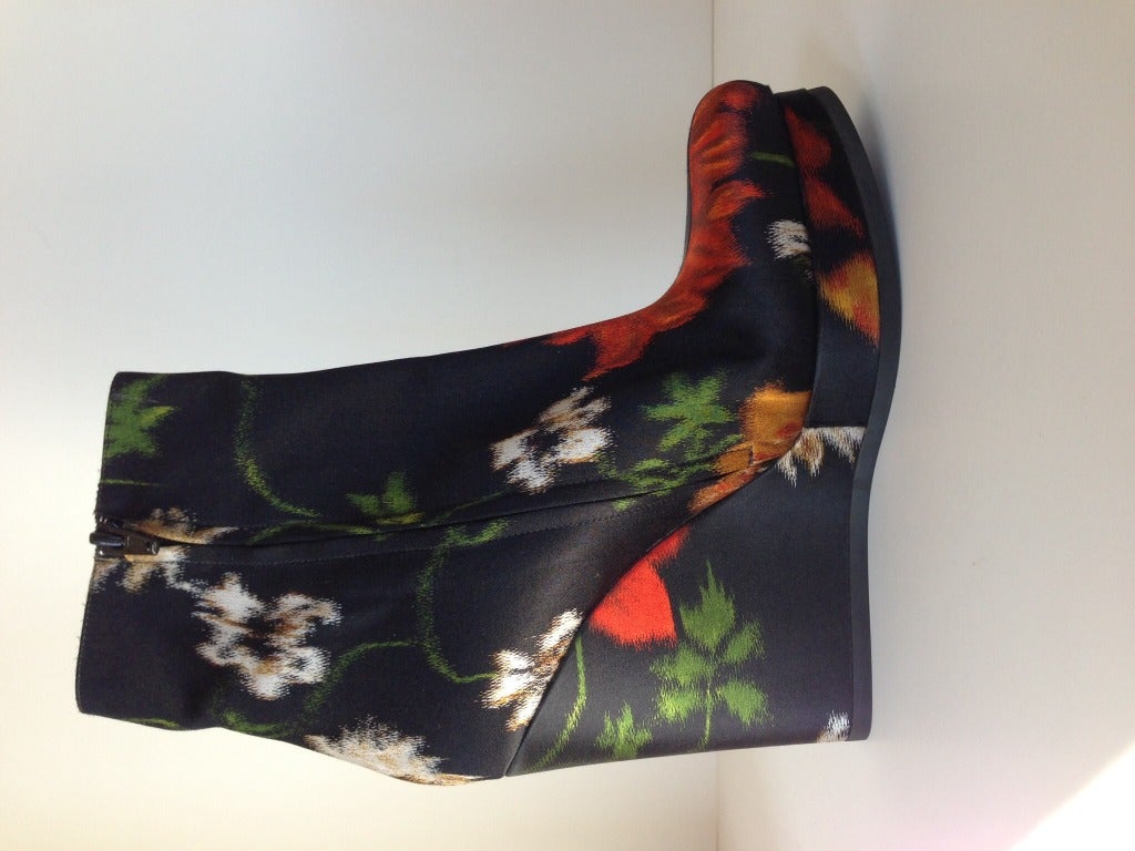 Who could resist these amazing boots.  Floral satin fabric covers the entirety of the platform boot.  All eyes will be on your feet as you strut your stuff!