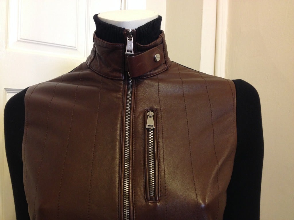Be biker chic in this fabulously soft jacket.  Supple brown leather covers the front body and back forearm.  The rest of the jacket is a delicious blend of silk, cashmere and nylon knit.  The gorgeous contrast of black and brown allows you to wear