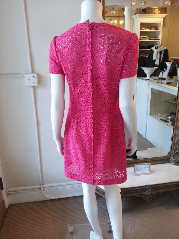 This dress was made for a party! Deep pink lace, a clean and casual shape, and a soft glossy finish mean you'll have so much fun in this Prada piece. One of the rare numbers that is both bold and versatile, this dress could be worn either for a