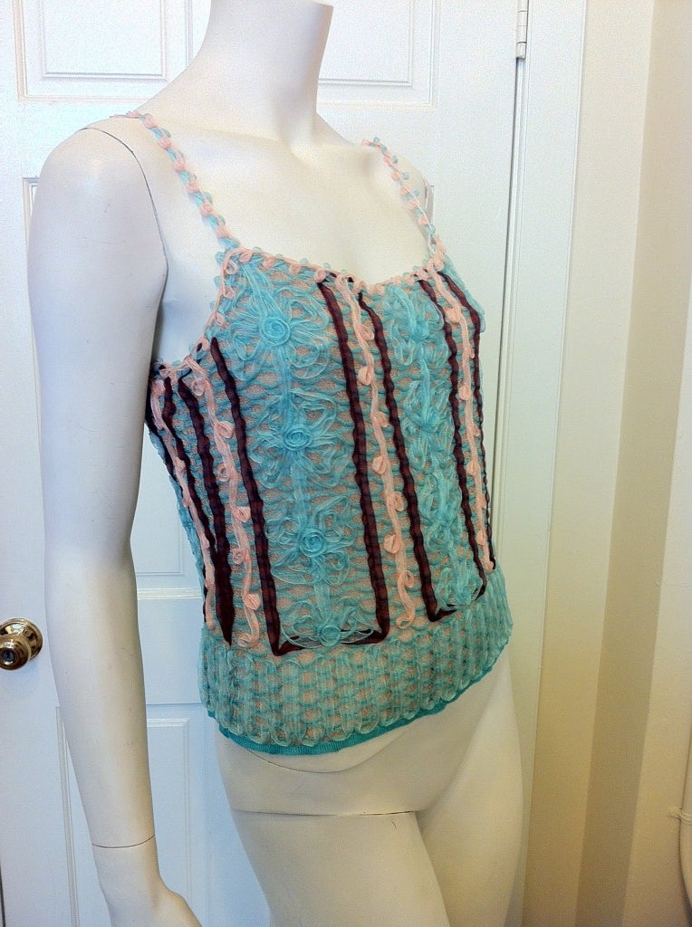 Cotton candy pinks and blues--this top is as sweet as can be!  Delicate ribbons are stitched on to the knit camisole for a pretty, feminine look.  The blue, floral design is accented by pink and maroon ribbons.  Even the straps are made of small