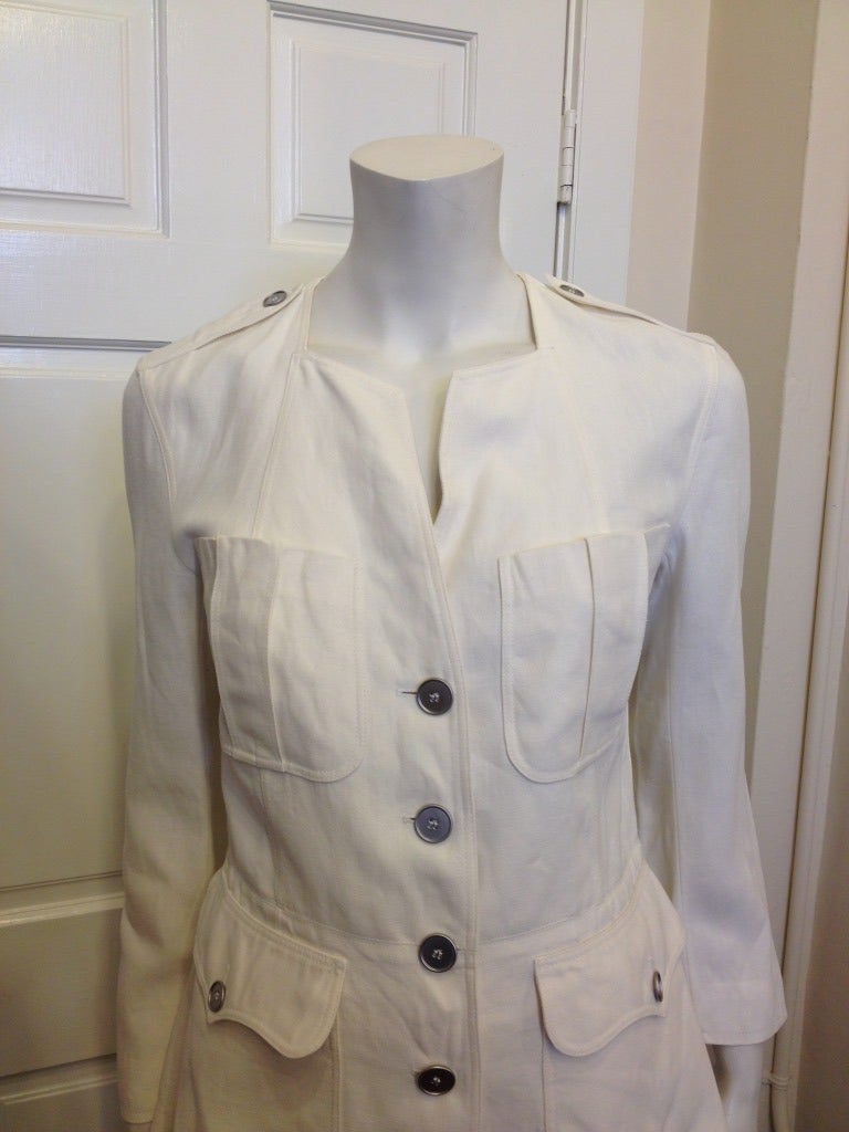 This white Hermes jacket will be a favorite all summer long.  As expected, the white linen is of the highest quality, as is the design element.  Large front pockets, two at the chest and two at the waist give this piece a casual feel.  The angular