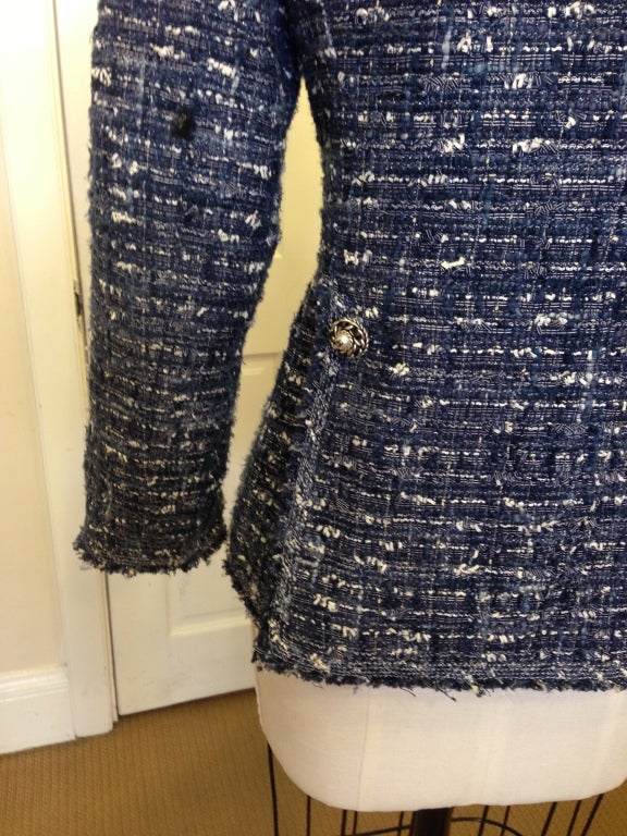 Chanel boucle spring jacket in a deep royal blue and white..perfect to dress up with a skirt or better even with jeans.

3 button front ( with very unique Chanel buttons, that have a double CC in the middle of the pearl and metal chain and leather