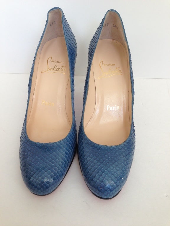 The most beautiful blue. Comfort is a factor in this shoe. The perfect height and color for a Classic pump.  This snake skin shoe is in perfect condition, except for a scuff on the Louboutin red bottom. (Please see photo)





3 1/4 inch heel