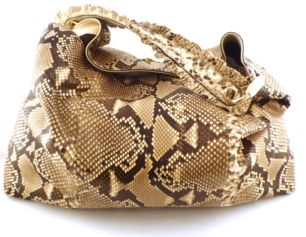 Beautiful python hobo with ruffled shoulder strap and gold hardware.

-Shoulder strap 11.5