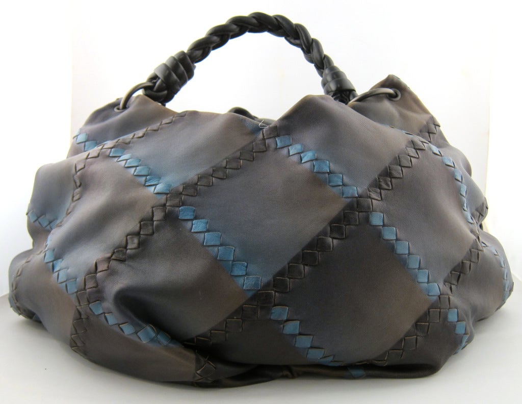 So hip! Limited edition spray paint leather hobo. Suede interior w/zippered divider pocket.  Shoulder handle with 5