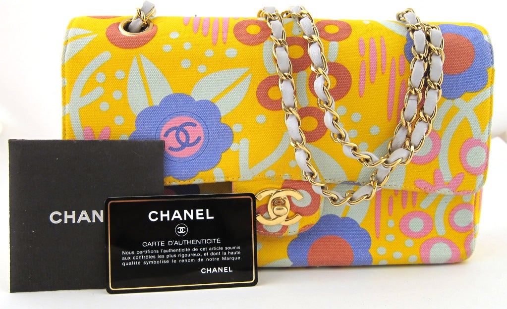 So fun and flowery! 2003 Chanel spring multi pocket handbag with original paperwork.

-Strap can be worn single (16