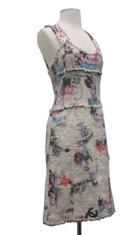 Chanel '07 Graffiti Dress. So cool! Chiffon, tweed and sequins. Excellent condition

Measurements:

- Bust 17