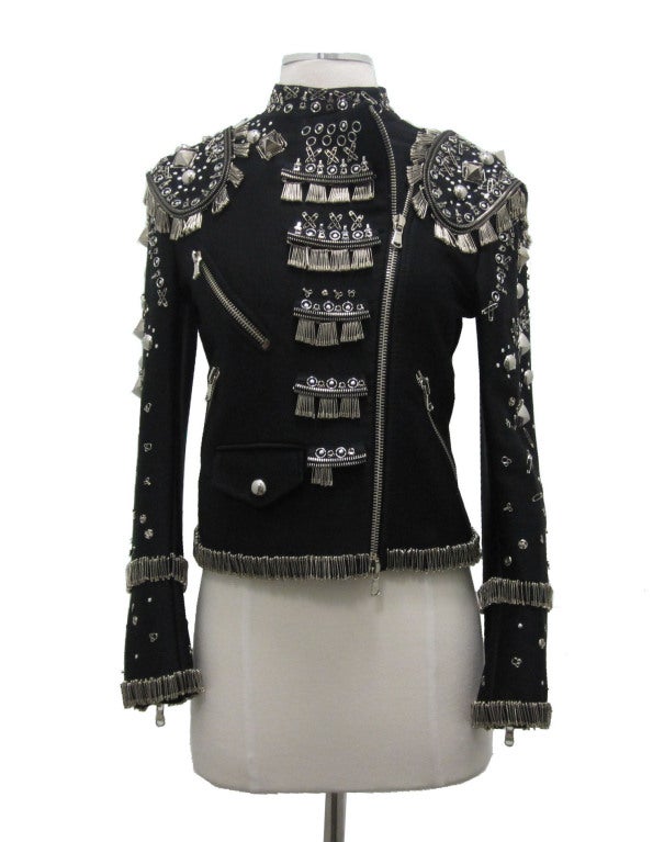 Moschino black jacket embellished with safety pins, studs, zippers, and hooks & eyes.

- Bust 17