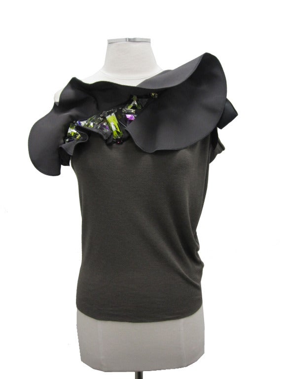 Gorgeous! Green, yellow, and purple jewels with a silk bow on the shoulder.

Measurements:

Length of Body - 21