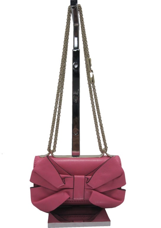 Pastel pink Valentino shoulder bag.

- Width 7