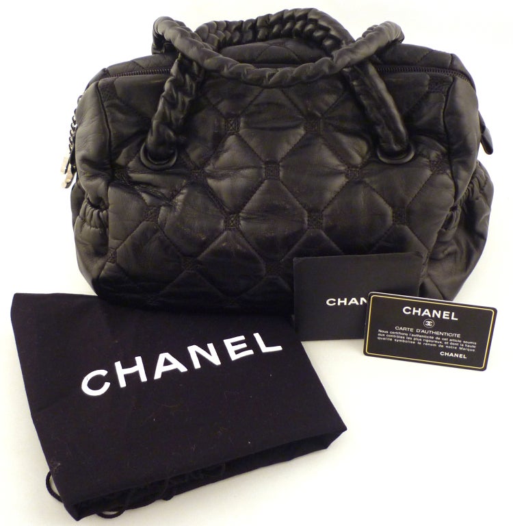 Luscious quilted black lambskin doctor bag with silver hardware from 2007.  Top handles are leather covered chain with a 3