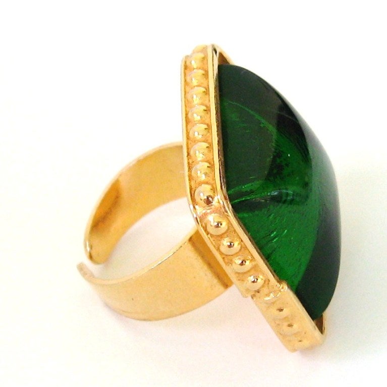 Another spectacular Creation from Phillipe Ferrandis. The color is a bold iridescent green This ring adjusts so you can alternate which finger to wear it on. There is a factory nib separation.   25.14 mm or 1-inch square -RING ADJUSTS in size. This