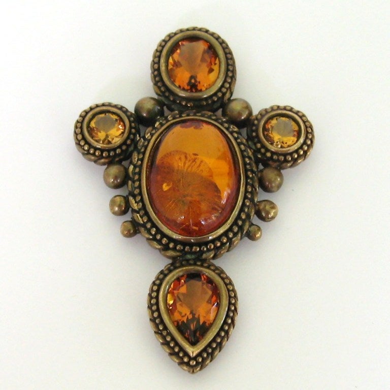 Another Stunning piece from Stephen Dweck

    Sterling silver with Bronze Wash
    Large Amber Center stone
    Stones are surrounded by braiding and large beads as well

Measures 3 x 2

This is  among a vast collection of Jewelry that was