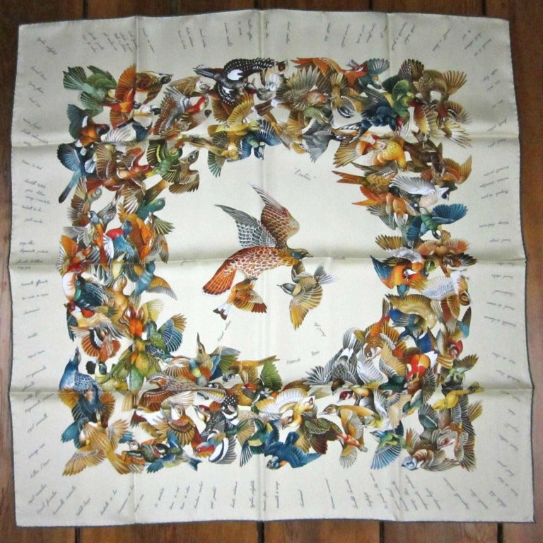 New old Stock, Never worn

    *massive center of Fluttering Birds
    *Tan w/ Green Rolled Border
    *100% Silk
    *Made in France
    *Hand Rolled of course!