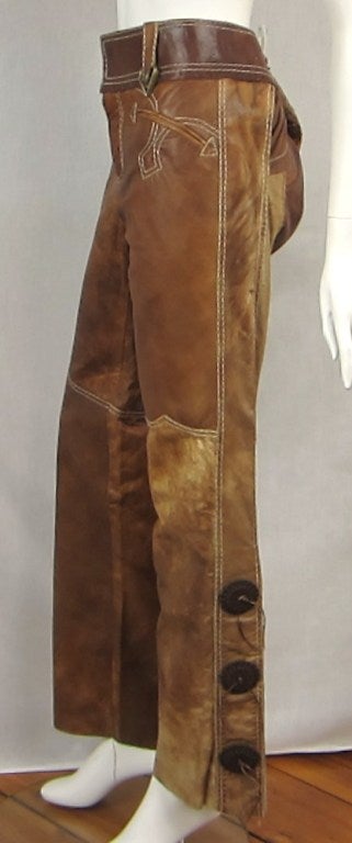 Roberto Cavalli Leather pants. These can be worn by both a men or women.
Great Concho detailing down the leg
Two back side buckles to tighen up the back a bit
Distressed leather

These still have the price tags attached. 875.00 
Never worn,