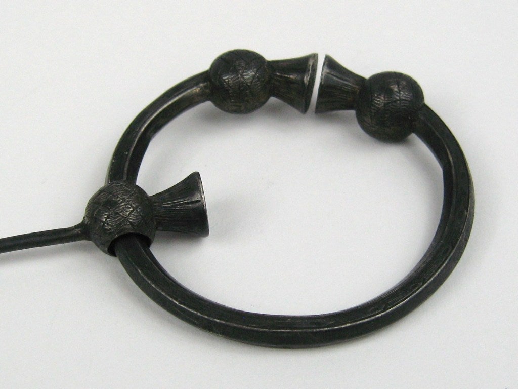 Wonderful Scottish Kilt Pin. 
You can use this as a brooch or coat pin.
Run a scarf through as well. 
A wonderful dark patina on this piece 

 A very nice example of the finer 19th Century Scottish Kilt Pins.