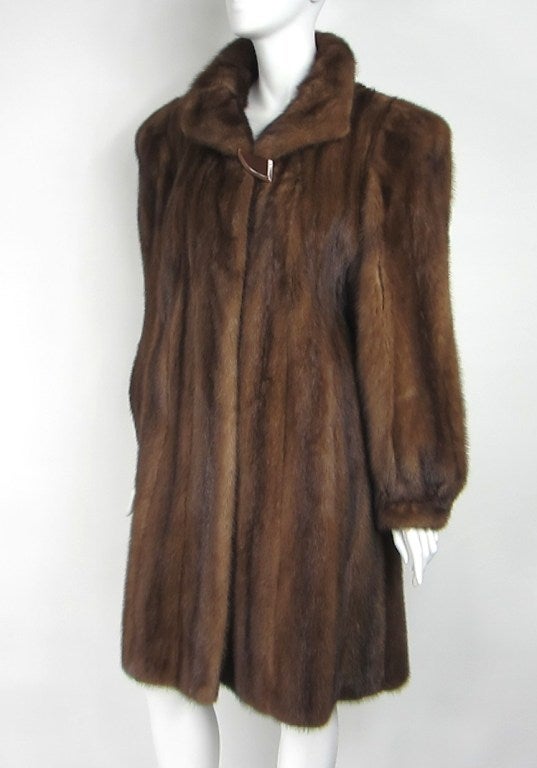 Amazing mink Swing Coat 
turn heads when you walk in a room
The coat has wide Shoulders for that Hollywood Glam look, 2 hooks down the front. Has Full Bell Sleeves with banded cuffs.
Labeled from the Famous 