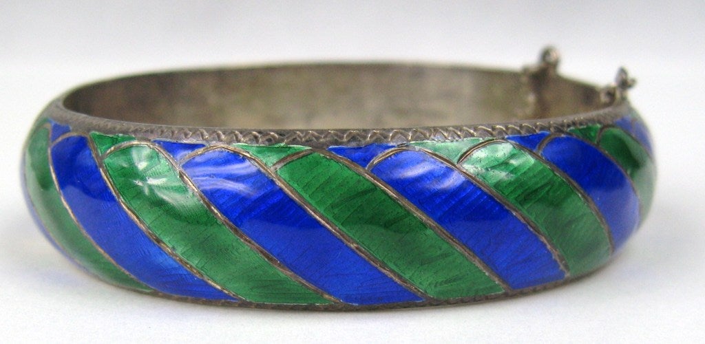 Stunning green and blue enamel on the diagonal 
Sterling Hallmarked 
Measures 
16.35mm /.64 In  wide 
Bracelet has a safety chain
Any questions please call, email or hit request more information 