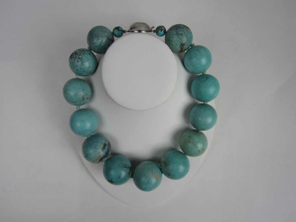 Stunning Sterling Turquoise Necklace
Hand Knotted, sterling silver slide clasp

Great veining in the Turquoise. 

Stones vary in size from 29.6 mm to 34 mm 
Measures 19