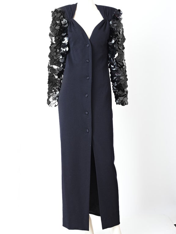 Galanos, wool jersey knit, evening coat dress with dramatic
sleeves embellished with large paillettes.