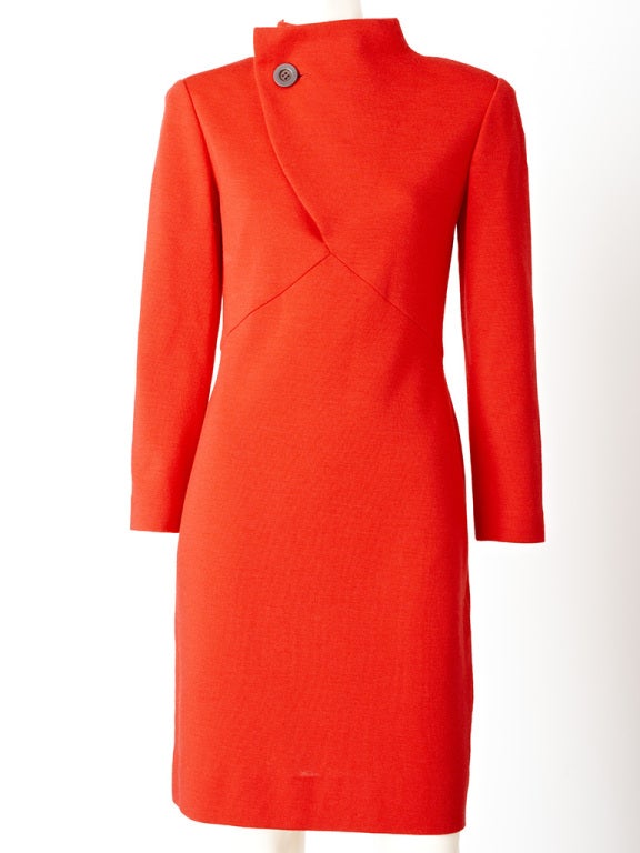 Geoffrey Beene, red wool jersey knit, empire waist dress, with
geometric seaming, funnel neck, asymmetric closure with a
wooden button.