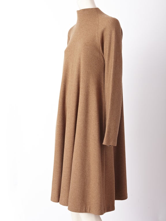 Geoffrey Beene, cafe au lait tone , wool knit tent dress with funnel neck and long sleeves.