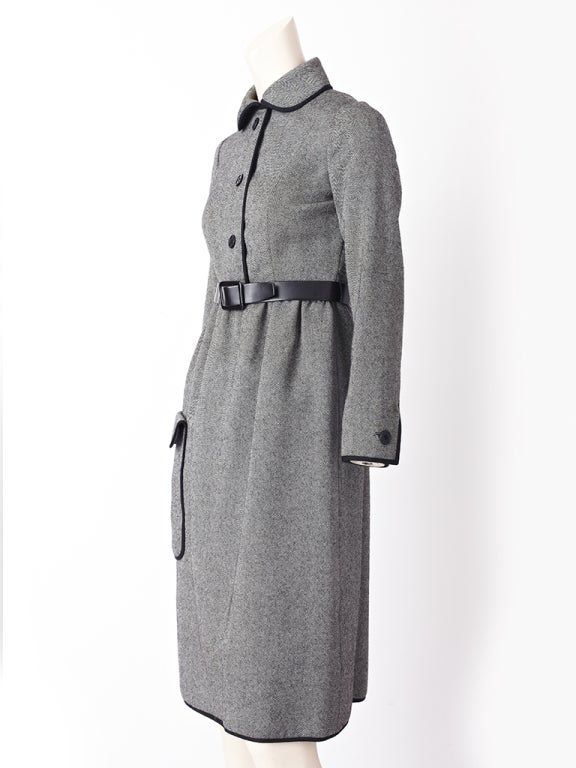 Geoffrey Beene, black and white tweed, wool day dress with Peter pan collar,
Slightly gathered skirt and low,placed deep side pocket.Dress is trimmed in black gross grain along, hem, cuffs collar, front bodice and pocket.