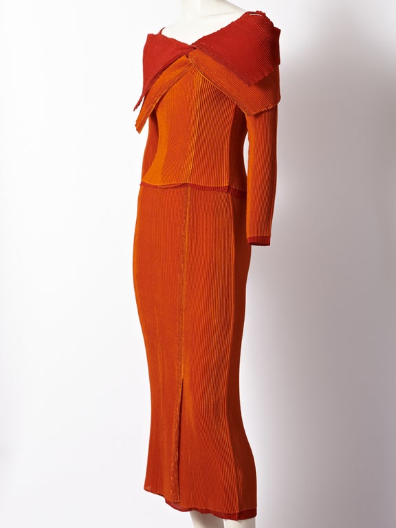 Issey Miyake, orange and red layered, pleated 2 piece ensemble. Top is pleated with 