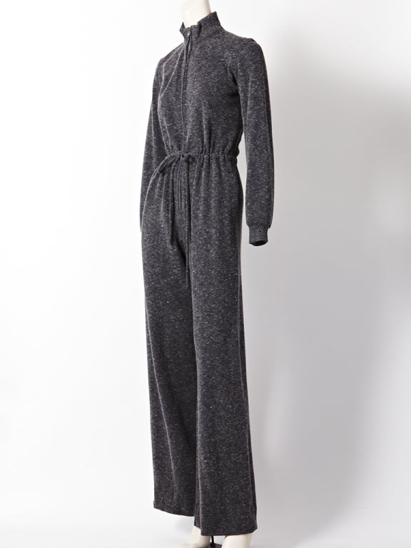 YSL, heather gray, wool jersey knit, jumpsuit with a drawstring waist and zipper front.