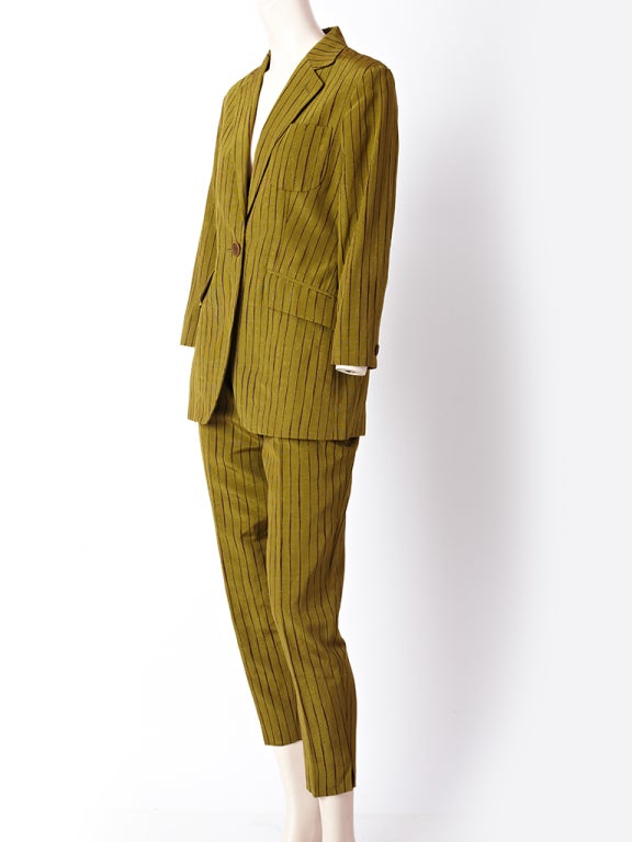 Romeo Gigli, olive green and burgundy stripe moire pant suit. Jacket is a single button closure, fitted and ends at the thigh. Pant is high waisted with a tappered leg. Summer 1996 collection.