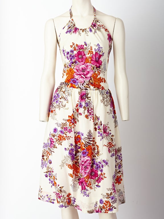 Givenchy, silk, floral print, halter dress with gathered skirt and slightly dropped waist detail.