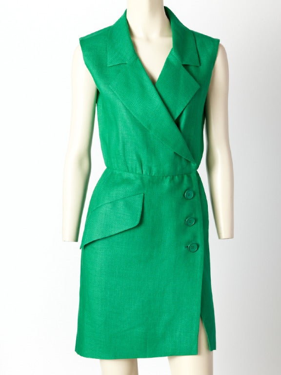 YSL, emerald green, linen, sleeveless, wrap dress with large notched collar, side closure with 3 buttons on the hip and an asymmetrically place side pocket detail.