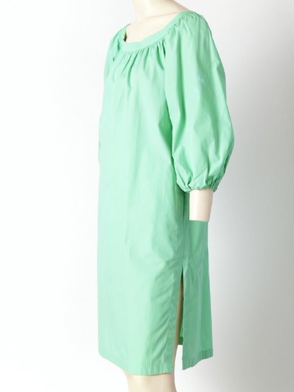 YSL, cotton, smock style, Peasant dress in a pretty mint green tone.Full sleeves and gentle smocking along the neckline. Side pockets inside the seams at the hips and side slits to allow for movement.