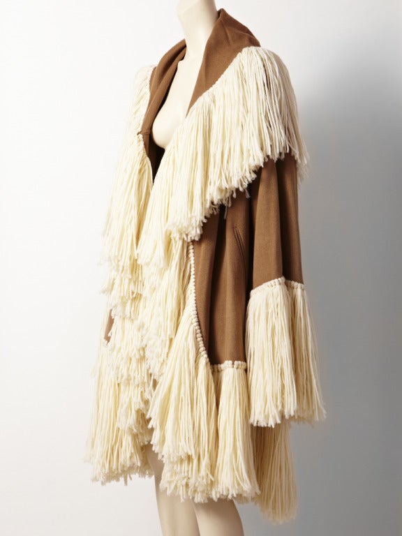 Moschino, wool, camel tone, oversize, coat with a shawl collar,  edged in ivory wool 11 inch fringe. New with original tags.