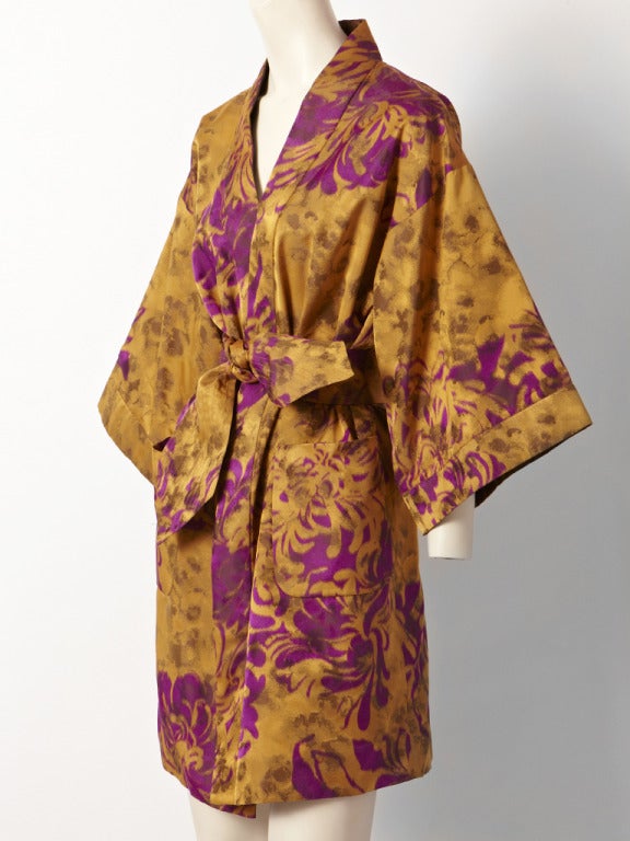 Valentin, printed taffeta, belted, kimono style coat in lovely shades of butterscotch and purple.Coat has large patch pockets.