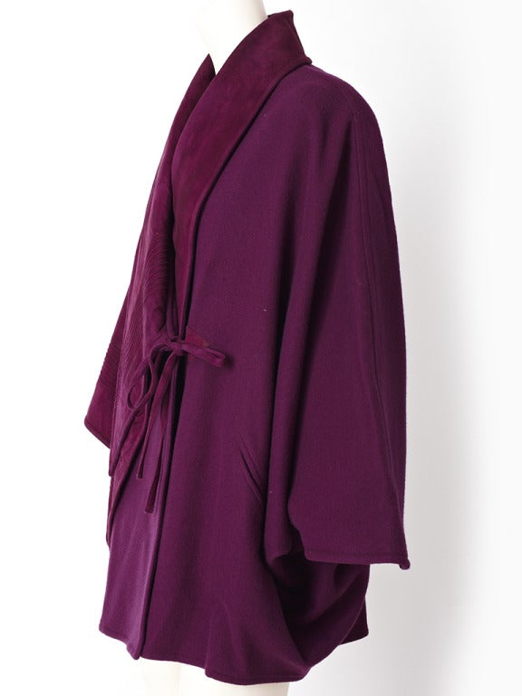 Ronaldus Shamask, purple wool poncho with a suede collar and asymmetric suede panel on the right side. Suede has 