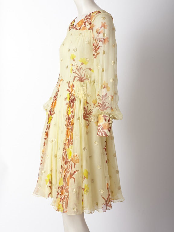 Valentino, yellow, floral chiffon dress with yoke,full sleeves, full flowing skirt and shirring detail at the hips. Late 1970's.