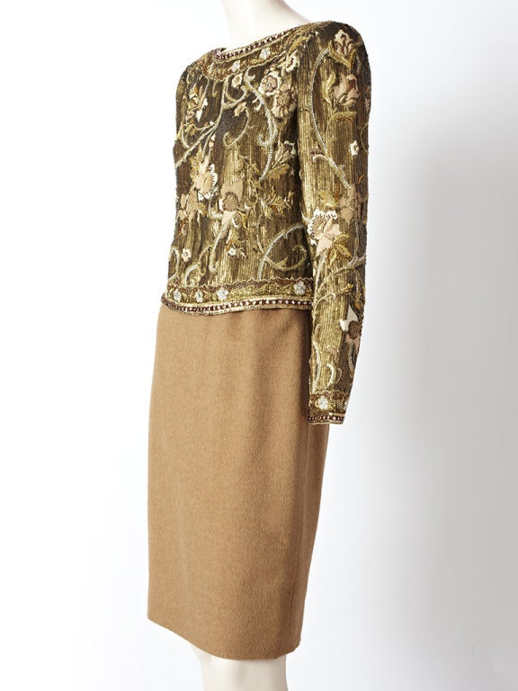 Carolyne Roehm, Bronze and camel tone sequined and wool 2 piece ensemble. Top is a metallic bronze tone, long sleeve, jeweled neckline,  with sequins and embroidery detail. Embroidery is a floral motif. Skirt is wool, camel tone, straight silhouette.