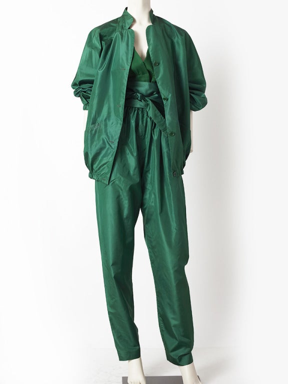 Halston, emerald green, taffeta and chiffon 3 piece pant evening ensemble.
Top is a halter style chiffon, jacket is loose and boxy made of taffeta and pant is taffeta as well. Comes with a wide wrap belt,also in taffeta.