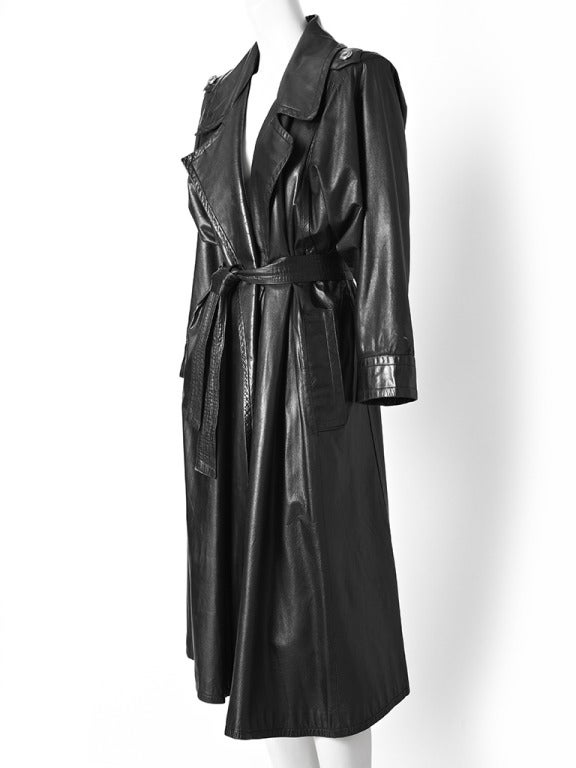 Yves Saint Laurent,black leather belted trench with wide notched collar and side pockets.