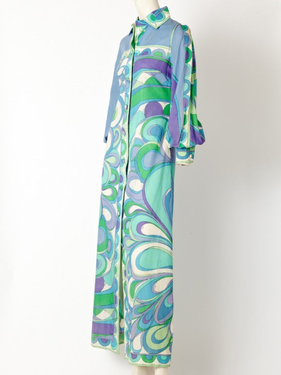 Pucci, cotton, shirt, maxi dress in shades of blues, greens, and lavender.
Bold pattern. Dress has a shirt collar with full sleeves that cuff at the wrist.
Buttons down he length of the dress with covers buttons.