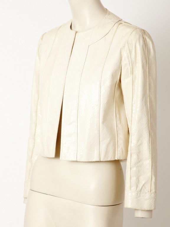 Bill Blass, ivory, genuine, python copped jacket. No collar, no closures with vertical top stitching detail.