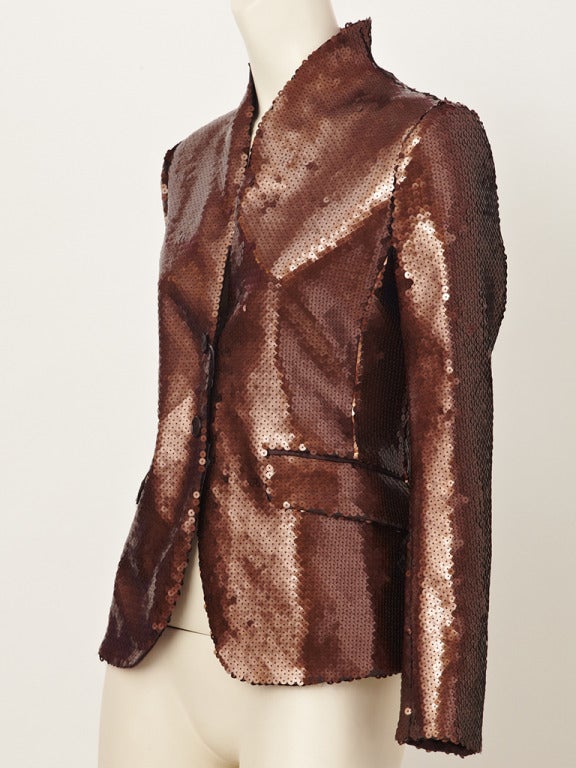 Alwxander McQueen, bronze toned sequined, fitted, blazer/jacket with shawl like collar, 2 button closure and flap pockets.