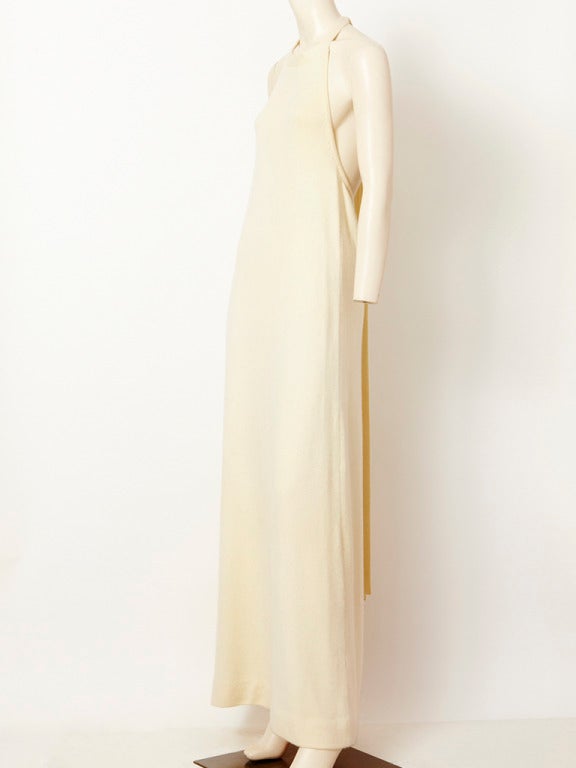 Halston, ivory, Scottish cashmere, long, halter gown with a simple A line shape and open back. Dress is anchored on the body with a tie that fastens on the back of the neck.