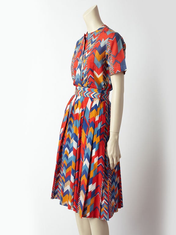 Hermes cotton geometric print collarless blouse and pleated skirt<br />
ensemble.