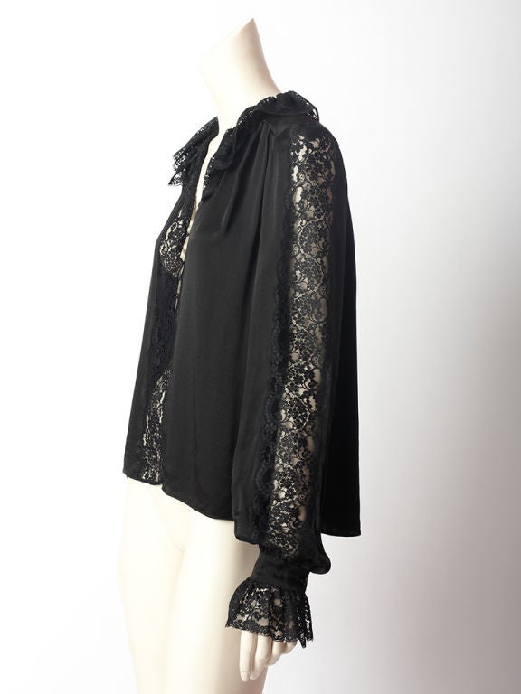 Givenchy silk charmeuse blouse with lace insets running along sleeve and middle front.<br />
Ruffled collar and cuffs are lace as well.